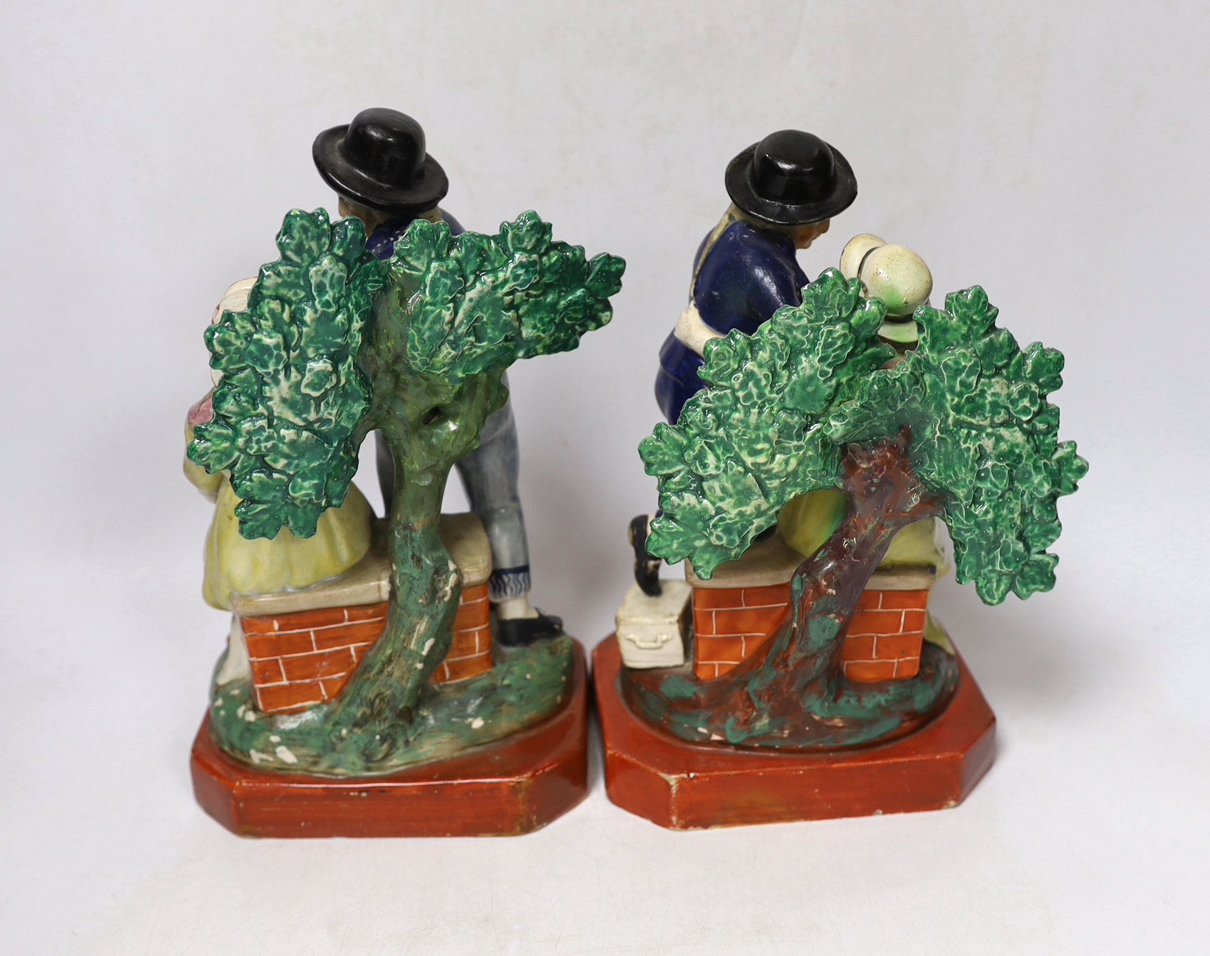 A pair of Staffordshire pearlware sailor groups 'Departure' and 'Return', c.1820, largest 23cm high